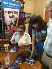 Christy Hoss signing books